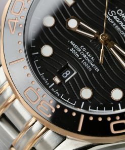 Đồng hồ Omega Seamaster Fake 11 Thuỵ Sỹ demi vàng hồng mặt đen 42mm (2)