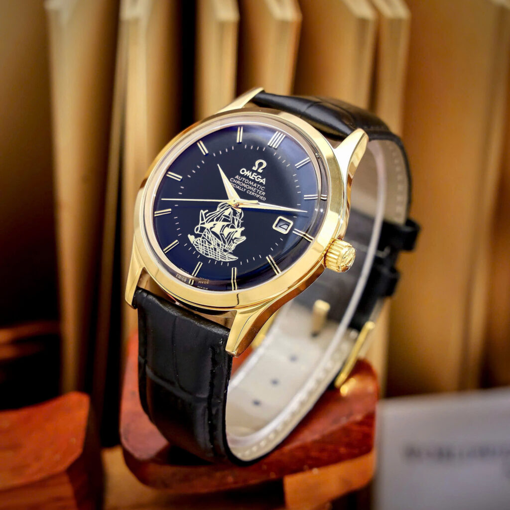 Đồng hồ Omega thuyền buồm vàng gold mặt đen máy cơ nhật giá rẻ 40mm