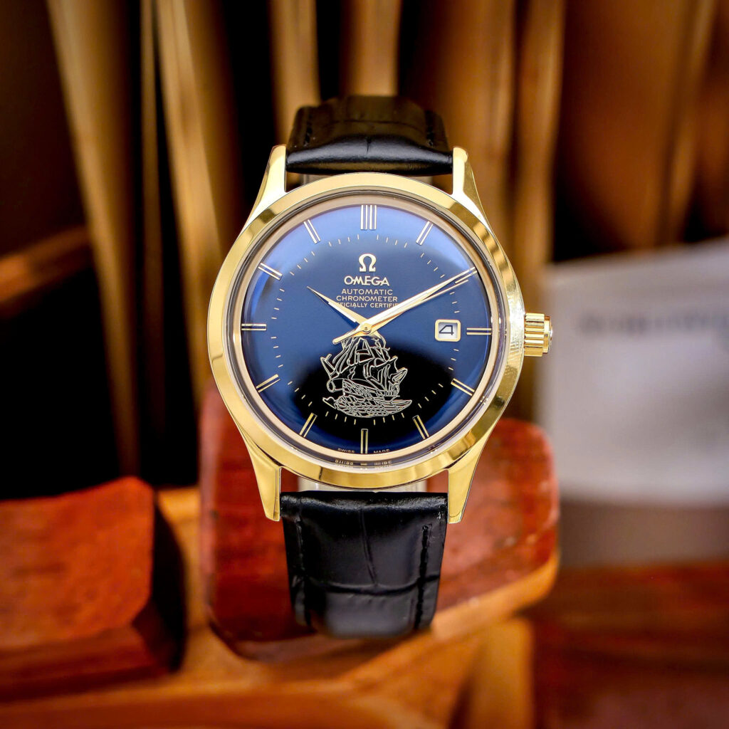 Đồng hồ Omega thuyền buồm vàng gold mặt đen máy cơ nhật giá rẻ 40mm