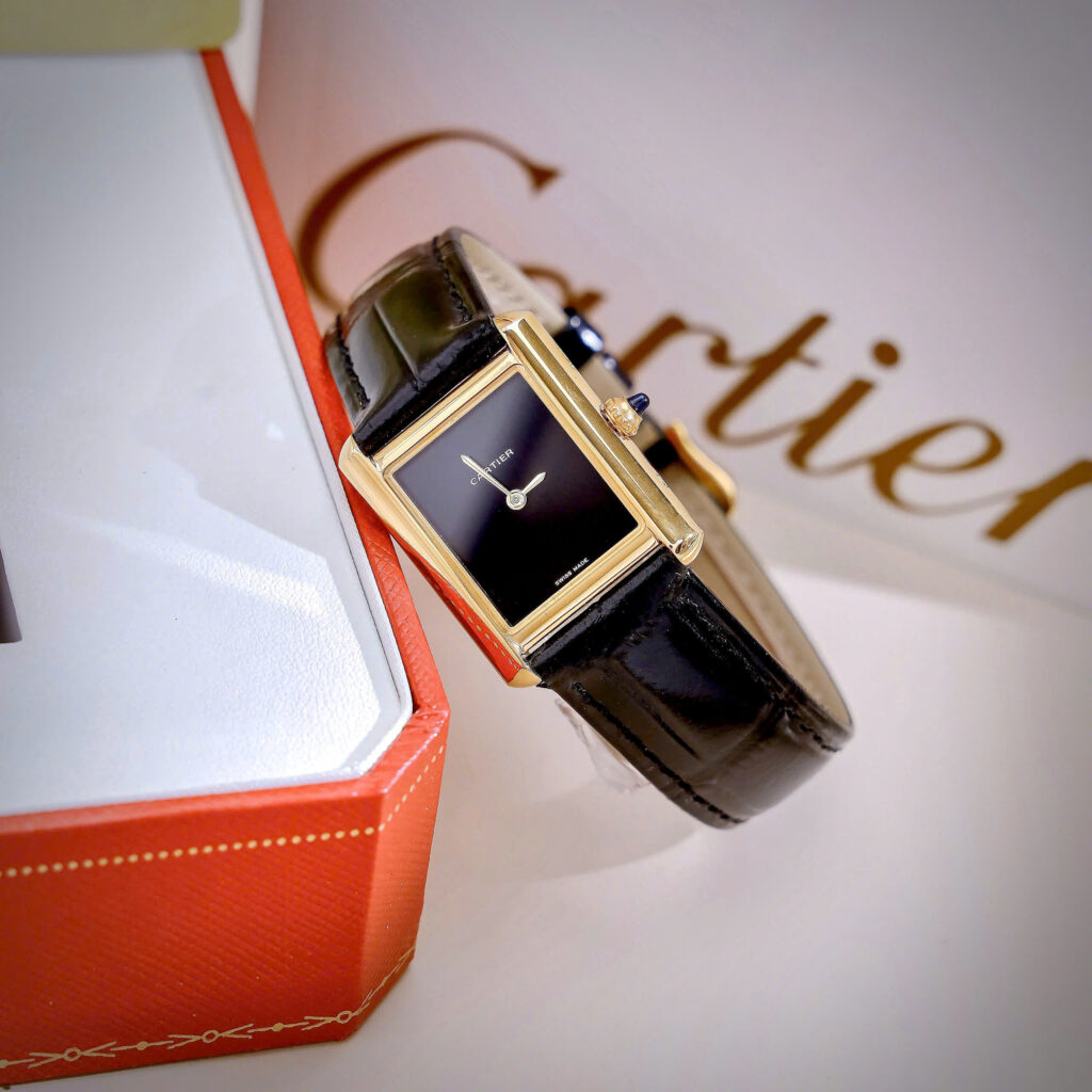 Đồng Hồ Cartier Tank Louis Nữ Vàng Gold Dây Da Đen Fake Cao Cấp 24x32mm