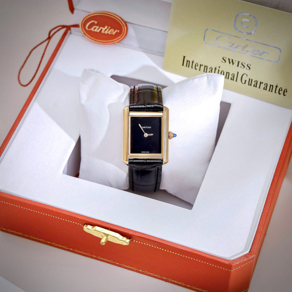Đồng Hồ Cartier Tank Louis Nữ Vàng Gold Dây Da Đen Fake Cao Cấp 24x32mm